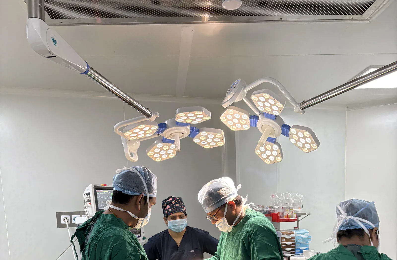 Dr. Kundan Kharde and the surgical team in the ISO 9001:2015 operation theatre at Sharvari Hospital, Pune